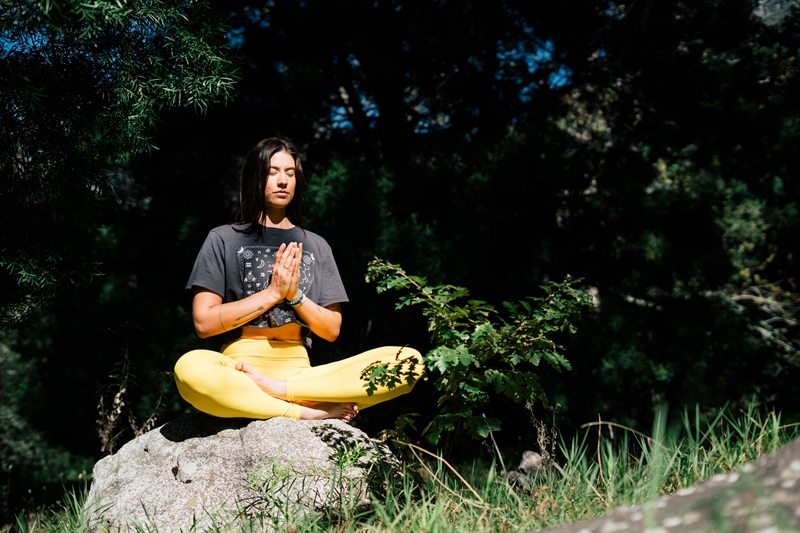 Man sitting cross-legged and meditating