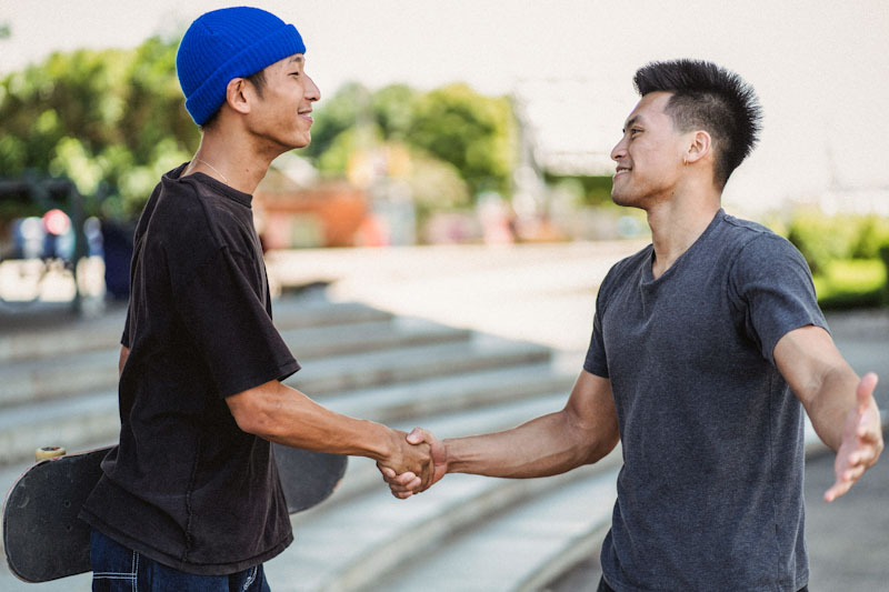 Two friends shaking hands
