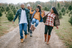 Mother, father and two kids on a hiking trail