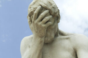 Statue holding head in hand