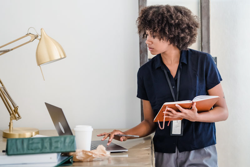 Nurse checking computer for treatment options