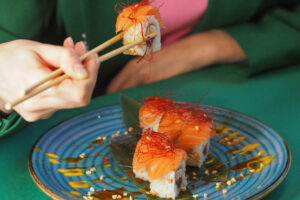 Eating sushi with chopsticks