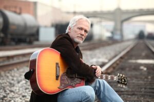 James Morrison posing with a guitar